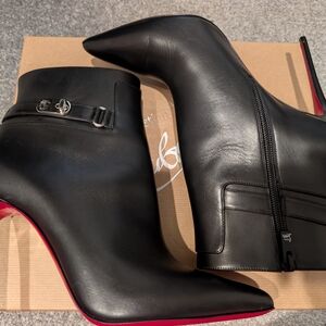 Christian Louboutin Black and Red Heeled Boots with Sleek Silhouette